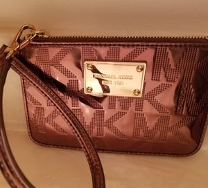 Michael Kors copper colored wristlet